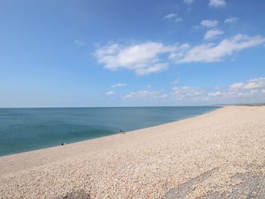 A beach with pebbles and sea at Flat 3
