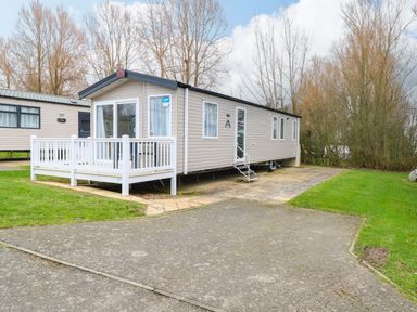 A caravan with decking and steps at Caravan in Great Yarmouth