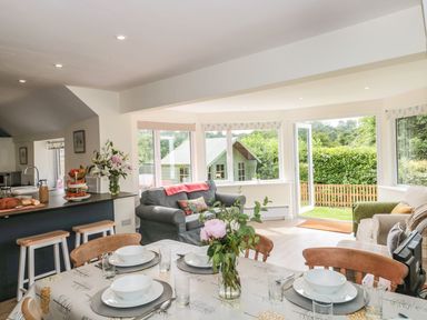 A dining room with table and chairs at Ammerham Farm Cottage Ammerham near Winsham