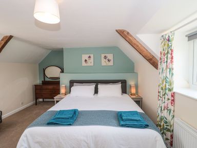 A bedroom with a bed and nightstand at Ammerham Farm Cottage Ammerham near Winsham
