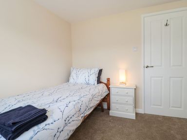 A bedroom with a bed and nightstand at Ammerham Farm Cottage Ammerham near Winsham