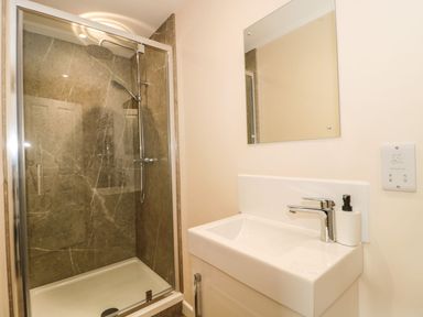 A bathroom with a shower and sink at Ammerham Farm Cottage in Ammerham near Winsham