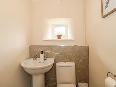 A bathroom with a sink and toilet at Ammerham Farm Cottage Ammerham near Winsham