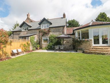 A house with a garden and outdoor seating at Ammerham Farm Cottage Ammerham near Winsham