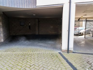 A garage with a parking space and brick walls at Mill Wharf in Berwick-upon-Tweed