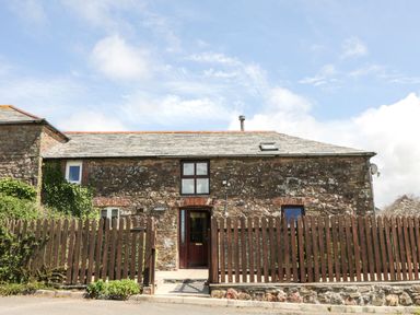An exterior view of a stone cottage at Applestore in Wadebridge