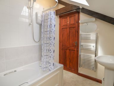 A bathroom with a shower and bath at Applestore in Wadebridge