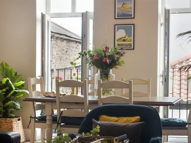 A dining room with a table and chairs at Juniper Cottage