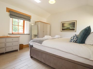 A bedroom with a bed and drawer unit at Little Trethellan in Trethellan near Lanner