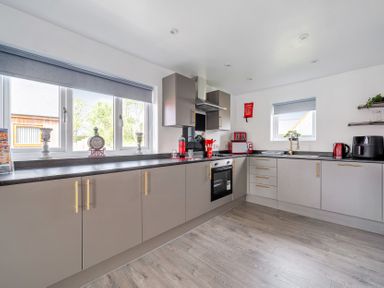 A kitchen with appliances and cabinets at Ruby Red near Brigg