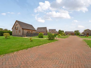 A view of multiple houses along a driveway at Pumpkin Lodge near Brigg