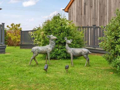 Deer statues in a garden at Pumpkin Lodge Near Brigg