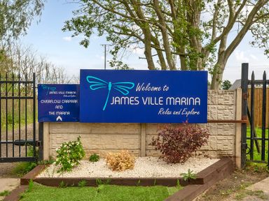 A sign at the entrance of James Ville Marina Near Brigg