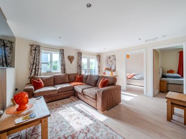 A living room with a sofa and coffee table at Lodge 25 - Pumpkin near Brigg