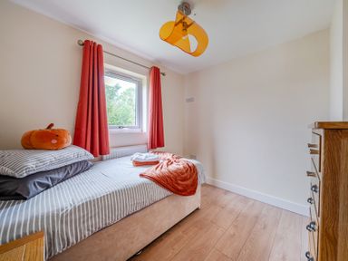 A bedroom with a bed and window at Lodge 25 - Pumpkin near Brigg