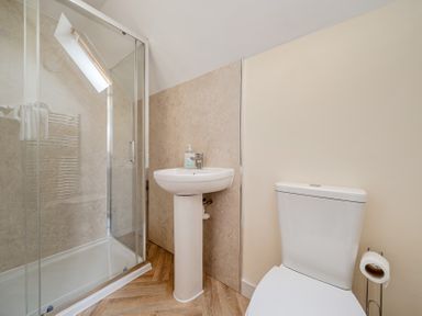 A bathroom with a shower enclosure, sink and toilet at Lodge 25 - Pumpkin Near Brigg