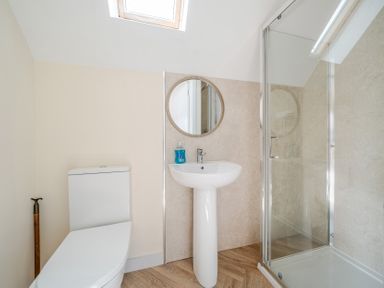 A bathroom with a shower and sink at Lodge 25 - Pumpkin near Brigg