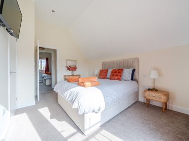 A bedroom with a bed and bedside table at Lodge 25 - Pumpkin Near Brigg
