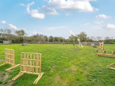 An outdoor play area with playground equipment at Lodge 25 - Pumpkin near Brigg