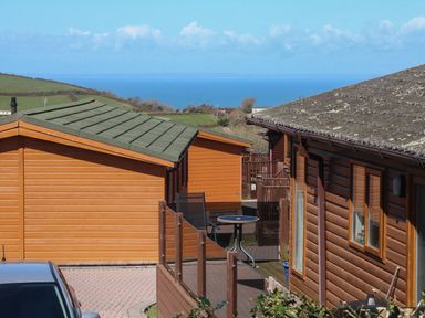An outdoor area with houses and a table at 1 Ocean Terrace Ilfracombe