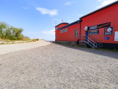 An entrance to Caister Lifeboat Experience with a path at Mabby Great Yarmouth