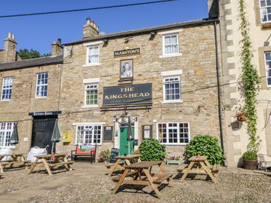 A pub exterior with seating outside at Swallows Rest Hexham