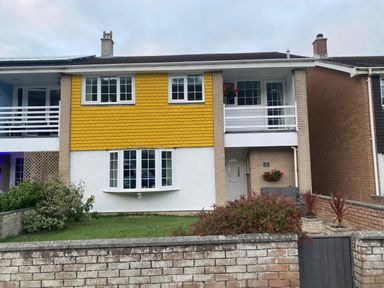 A house with multiple windows and a balcony at 16 Forth An Nance Portreath