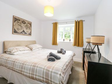 A bedroom with a bed and window at The Ivy in Norwich