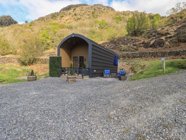 A house with outdoor seating and gravel area at Bluebelle - Crossgate Luxury Glamping in Hartsop