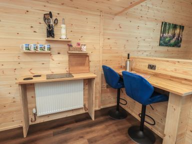 A kitchen area with mugs and counter space at Bluebelle - Crossgate Luxury Glamping Hartsop