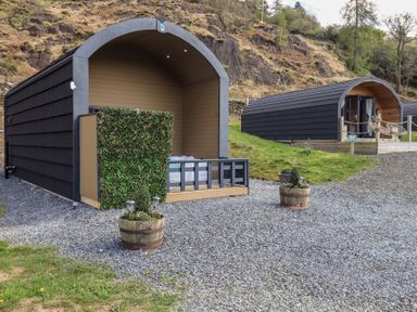 Two glamping pods in a garden area at Bluebelle - Crossgate Luxury Glamping Hartsop