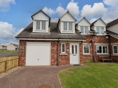 A house with a garage and a lawn at 35 Longbeach Drive