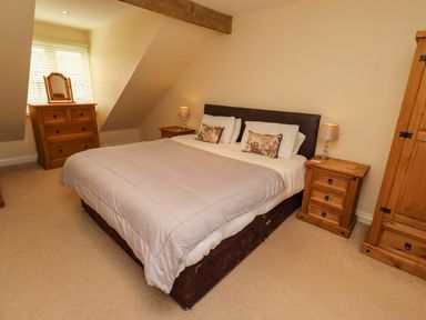 A bedroom with a bed and furniture at 35 Longbeach Drive