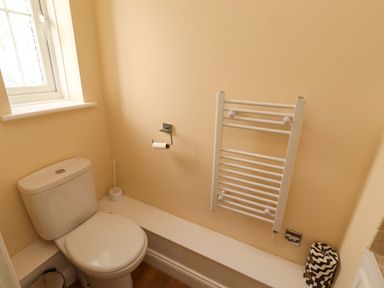 A bathroom with a toilet and towel rail at 35 Longbeach Drive