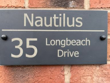A nameplate displaying Nautilus at 35 Longbeach Drive Beadnell