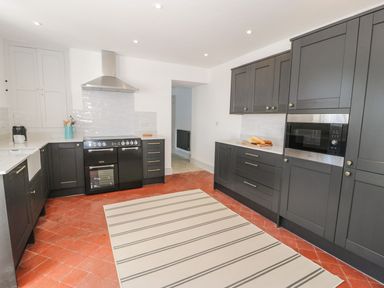 A kitchen with cabinets and appliances at Ty Mawr Farm in Llanfairpwllgwyngyll