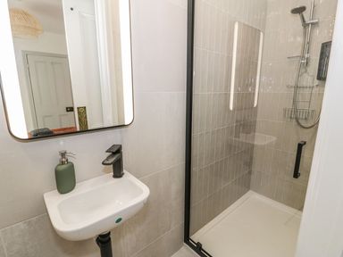 A bathroom with a sink and shower at Ty Mawr Farm Llanfairpwllgwyngyll