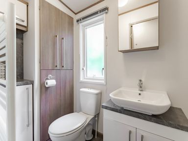 A bathroom with a sink and toilet at Fern View -Kelling Heath Holiday Park Weybourne near Sheringham