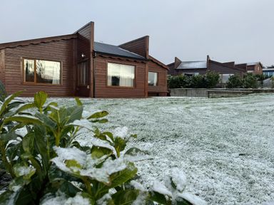 A house with windows and a grassy area at No 4 in Enniskillen