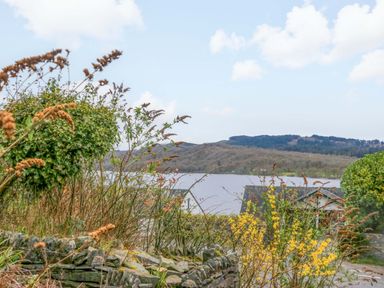 An outdoor view of a lake and hills at Wilders Wood Windermere