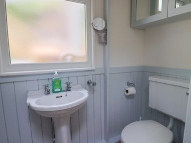 A bathroom with a sink and toilet at Salt & Stone in Lyme Regis