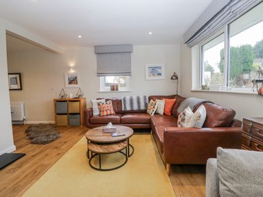 A living room with a sofa and coffee table at Ambwray in Ambleside
