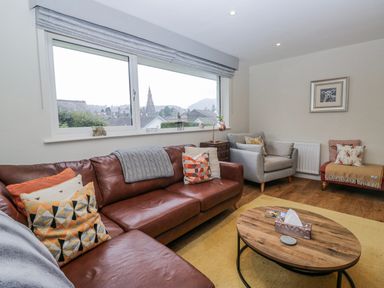 A living room with a sofa and coffee table at Ambwray in Ambleside