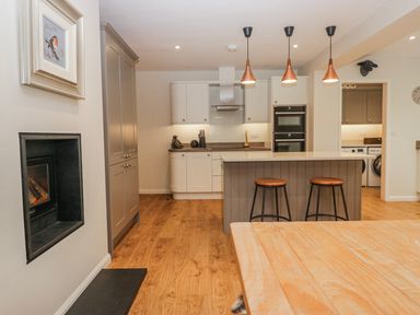 A kitchen with cabinets and appliances at Ambwray in Ambleside