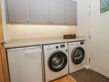 A laundry room with a washing machine and dryer at Ambwray in Ambleside