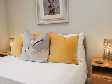 A bedroom with a bed and pillows at Ambwray in Ambleside