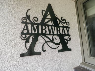 A sign with the name Ambwray on a wall at Ambwray Ambleside