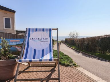 A deck chair with a sign at Ladram Bay Holiday Park in Ladram Bay Otterton