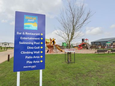 An outdoor area with playground and facilities at Broadland Sands Holiday Park in Corton