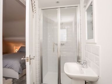 A bathroom with a shower and sink at Rhiwlas, Rhosneigr